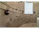 Large walk-in shower with tile walls and glass block window at 10630 E Cactus View Cir, Gold Canyon, AZ 85118