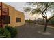 Landscaped side yard with a spiral staircase and mountain view at 10630 E Cactus View Cir, Gold Canyon, AZ 85118