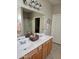 Double vanity bathroom with a large mirror and walk-in shower at 10660 W Monaco Blvd, Arizona City, AZ 85123