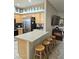 Kitchen with breakfast bar and stylish pendant lighting at 10660 W Monaco Blvd, Arizona City, AZ 85123