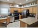 Well-equipped kitchen featuring stainless steel appliances and wood cabinets at 10660 W Monaco Blvd, Arizona City, AZ 85123