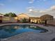 Inviting kidney-shaped pool with patio and lounge chairs at 10660 W Monaco Blvd, Arizona City, AZ 85123