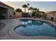 Large kidney shaped pool with surrounding patio at 10660 W Monaco Blvd, Arizona City, AZ 85123