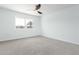 Bright bedroom with ceiling fan and carpet flooring at 10826 W Loma Blanca Dr, Sun City, AZ 85351