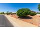 Residential street view showcasing a well-maintained neighborhood at 10826 W Loma Blanca Dr, Sun City, AZ 85351