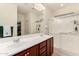 Double vanity bathroom with large walk-in shower at 11047 E Tupelo Ave, Mesa, AZ 85212