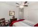 Comfortable bedroom with a ceiling fan and built-in shelving at 11047 E Tupelo Ave, Mesa, AZ 85212