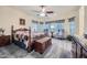 Charming bedroom with a wooden bed frame and window seating at 11047 E Tupelo Ave, Mesa, AZ 85212