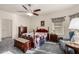 Main bedroom with queen bed, dresser, and seating at 11047 E Tupelo Ave, Mesa, AZ 85212