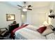 Bright bedroom featuring a ceiling fan, closet, and carpet flooring at 11047 E Tupelo Ave, Mesa, AZ 85212