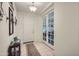 Elegant entryway with tile flooring and French doors leading to the living area at 11047 E Tupelo Ave, Mesa, AZ 85212