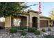 One story home with a brown garage door and manicured landscaping at 11047 E Tupelo Ave, Mesa, AZ 85212