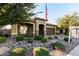 Single-story home with a brown garage door and neatly landscaped front yard at 11047 E Tupelo Ave, Mesa, AZ 85212