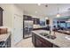 Kitchen island with granite countertop, double sink, and stainless steel appliances at 11047 E Tupelo Ave, Mesa, AZ 85212