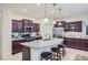 Spacious kitchen with granite countertops and dark wood cabinets at 11047 E Tupelo Ave, Mesa, AZ 85212