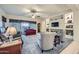 Living room with a built-in entertainment center and plush seating at 11047 E Tupelo Ave, Mesa, AZ 85212