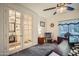 Cozy home office with built-in shelving and a comfortable rocking chair at 11047 E Tupelo Ave, Mesa, AZ 85212