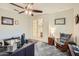 Bright home office with a view into the hallway and a comfortable rocking chair at 11047 E Tupelo Ave, Mesa, AZ 85212