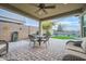 Covered patio with seating area and artificial turf at 11047 E Tupelo Ave, Mesa, AZ 85212