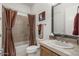 Clean bathroom with a shower/tub combo and a single vanity at 12067 N 135Th Way, Scottsdale, AZ 85259