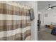 Simple bathroom with shower stall and striped shower curtain at 12067 N 135Th Way, Scottsdale, AZ 85259