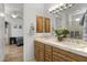 Double vanity bathroom with wood cabinets at 12067 N 135Th Way, Scottsdale, AZ 85259