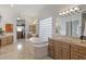 Spa-like bathroom featuring a large soaking tub and and sinks at 12067 N 135Th Way, Scottsdale, AZ 85259