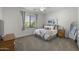 Spacious bedroom with a large bed and mirror at 12067 N 135Th Way, Scottsdale, AZ 85259