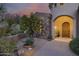 Welcoming entryway with a charming wooden door and stone accents at 12067 N 135Th Way, Scottsdale, AZ 85259