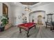 Elegant game room with a pool table and plenty of space for entertainment at 12067 N 135Th Way, Scottsdale, AZ 85259