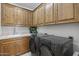 Laundry room with washer, dryer, and cabinets at 12067 N 135Th Way, Scottsdale, AZ 85259