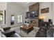 Relaxing living room with stone fireplace and patio access at 12067 N 135Th Way, Scottsdale, AZ 85259