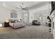 Large main bedroom with a plush carpet, fireplace, and walk-in closet at 12067 N 135Th Way, Scottsdale, AZ 85259