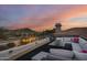 Rooftop deck with sectional seating, fire pit, and mountain views at 12067 N 135Th Way, Scottsdale, AZ 85259