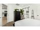 Main bedroom with a queen-size bed and a view into the kitchen at 1217 S Desert View Pl, Apache Junction, AZ 85120