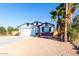 Newly constructed home with a two-car garage and desert landscaping at 1217 S Desert View Pl, Apache Junction, AZ 85120