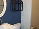 Small bathroom with white sink and blue walls at 1231 E Helena Dr, Phoenix, AZ 85022