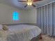 Bright bedroom with a ceiling fan and window at 1231 E Helena Dr, Phoenix, AZ 85022