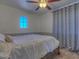 Bright bedroom with a comfortable bed and large window at 1231 E Helena Dr, Phoenix, AZ 85022