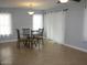 Bright dining area with glass table and tile floor at 1231 E Helena Dr, Phoenix, AZ 85022