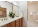 Bathroom with double vanity and large mirror at 12947 W Chapala Dr, Sun City West, AZ 85375