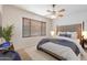 Main bedroom with ceiling fan and neutral decor at 12947 W Chapala Dr, Sun City West, AZ 85375