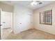 Bright bedroom with double door closet and carpet flooring at 12947 W Chapala Dr, Sun City West, AZ 85375