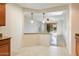 View from kitchen to dining area and living room beyond at 12947 W Chapala Dr, Sun City West, AZ 85375