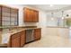 Kitchen with corner sink, granite countertops, and stainless steel dishwasher at 12947 W Chapala Dr, Sun City West, AZ 85375