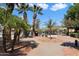 Relaxing resort-style pool with lounge chairs and shade umbrellas at 12947 W Chapala Dr, Sun City West, AZ 85375