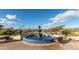 Serene water fountain with seating area overlooking golf course at 12947 W Chapala Dr, Sun City West, AZ 85375