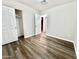 Bright bedroom with double door closet and wood-look vinyl flooring at 1325 W 7Th Ave, Mesa, AZ 85202