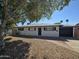 Charming single story home with a landscaped yard and a two-car garage at 1325 W 7Th Ave, Mesa, AZ 85202