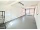 Spacious garage with freshly painted floor and shelving unit at 1325 W 7Th Ave, Mesa, AZ 85202